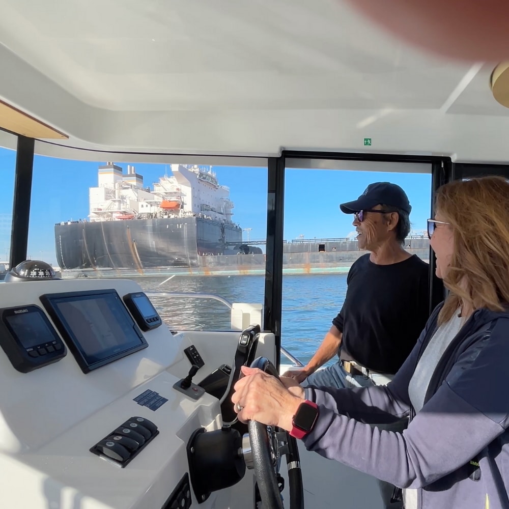 Boating Lesson Student Driving with Captain on the San Francisco Bay